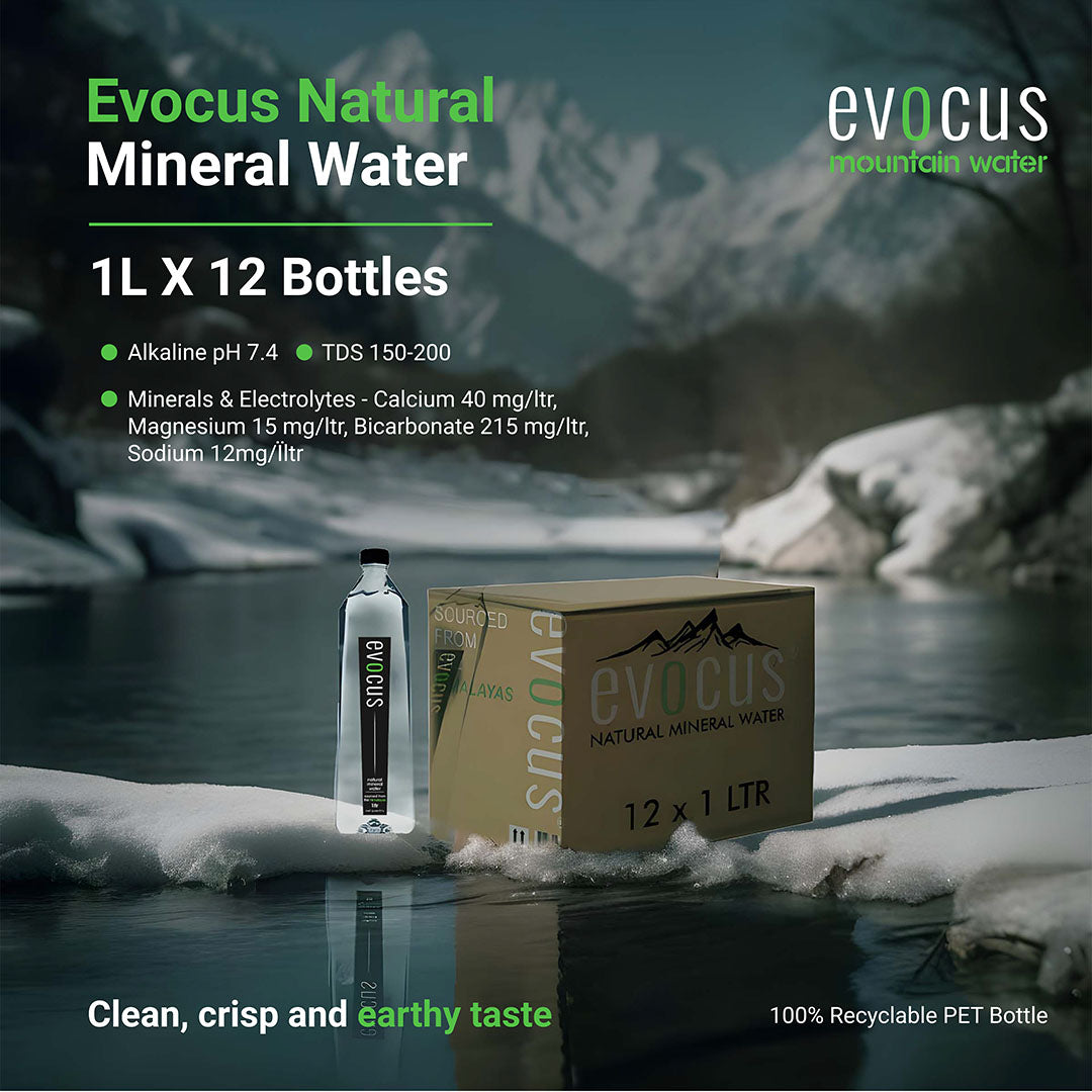 Case of 12 Evocus Natural Mineral Water bottles sits by a river. Text highlights its alkaline pH, mineral content, and eco-friendly packaging.